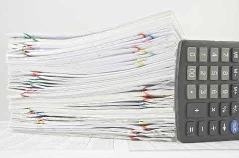 Stack paperwork of sales and receipt with calculator Stock Photos