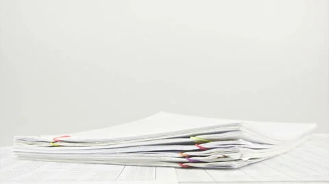 Stack paperwork on table time lapse Stock Footage 45770619