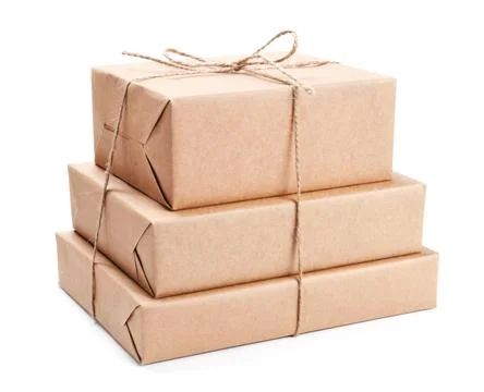 Stack of parcel wrapped with brown packing paper Stock Photos