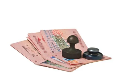 Stack of passports and stamp Stock Photos