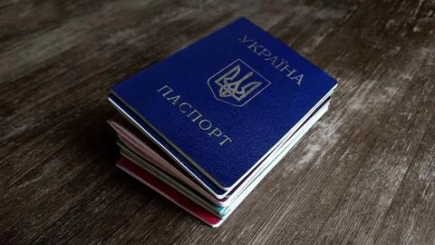 A stack of passports from different countries Foto stock