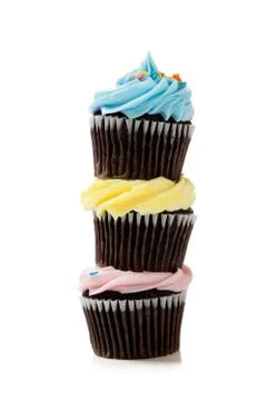 A stack of pastel cupcakes on a white background Stock Photos