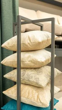 Stack of patterned decorative pillows in modern interior design display Stock Photos
