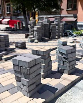 Stack of paving stones on construction site on the street Stock Photos