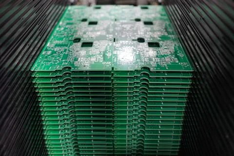 Stack of PCB panels in SMT loader ready for automated SMD placement Stock Photos
