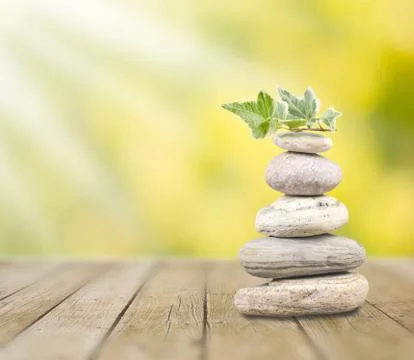 Stack pebbles and sunshine Stockfoto's