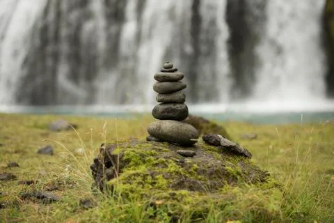 Stack of pebbles and waterfall Stock Photos