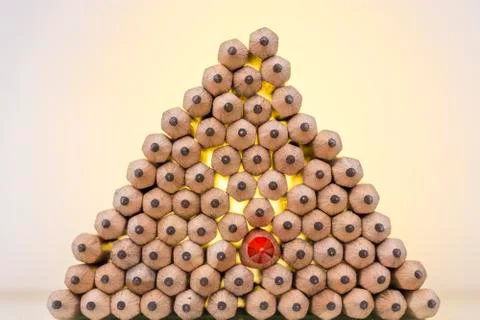 Stack of pencils and a red colored pencil Stock Photos