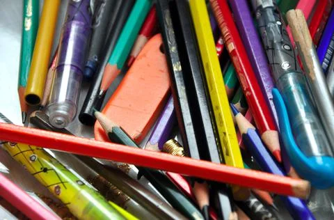 Stack of pencils on the desk used in school and office, multicolored crayons Stock Photos