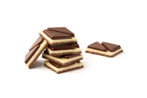Stack of pieces of milk chocolate isolated on white background Stock Photos