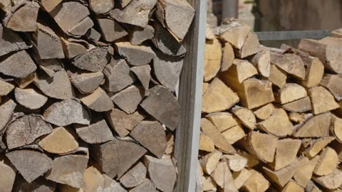 The stack of piled firewoods on the yard in Estonia Vídeo Stock 246015676