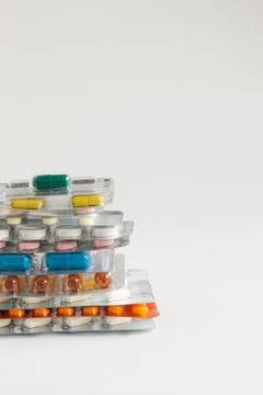 Stack of pills on a white background Stock Photos