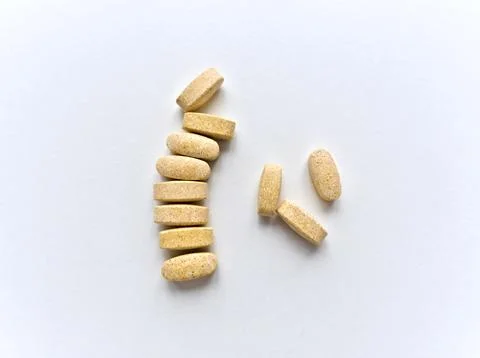 A stack of pills on a white background Stock Photos