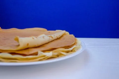 A stack of pimples with a semi-jam on blue minimal background Stock Photos