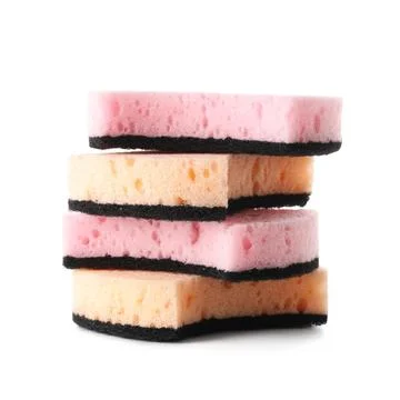 Stack of pink and orange kitchen sponges with black abrasive layers, househol Fotos de archivo
