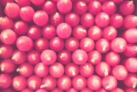 Stack of pink candles creates a pattern Foto stock