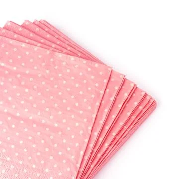 Stack of pink dotted paper napkins on white background 스톡 사진