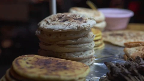 Stack of pita bread and skewered meat at the market stall Stock Footage 85769340