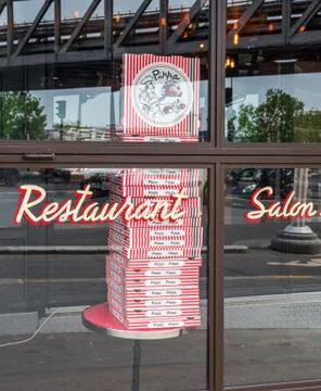 Stack of pizza boxes in a restaurant during Coronavirus Lockdown in Paris Stock Photos
