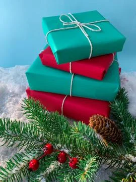 Stack of plain-colored Christmas presents on a snow Stock Photos