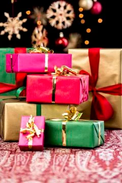 Stack of plain colored xmas gifts Stock Photos