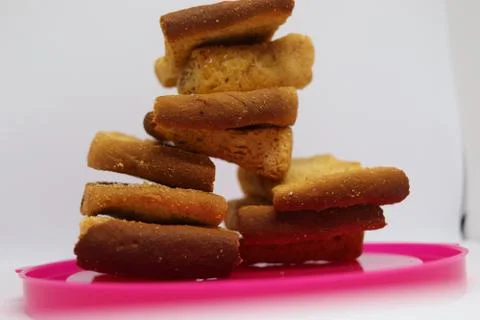 Stack of plain melba toasts on white Background. Edible square dry toast slic Stock Photos