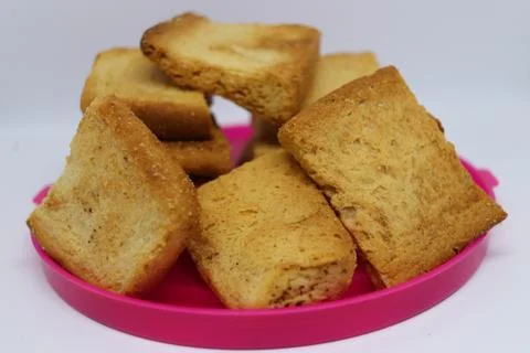 Stack of plain melba toasts on white Background. Edible square dry toast slic Stock Photos