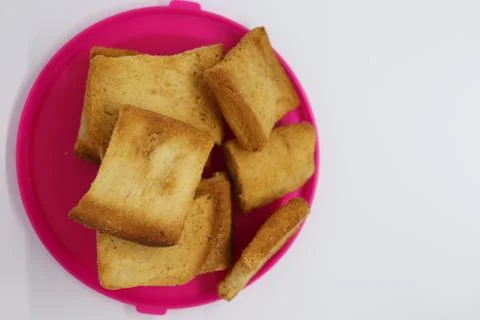 Stack of plain melba toasts on white Background. Edible square dry toast slic Stock Photos