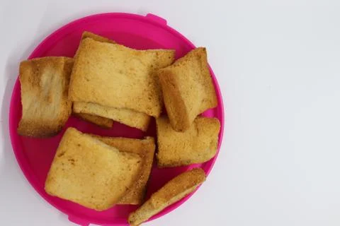 Stack of plain melba toasts on white Background. Edible square dry toast slic Stock Photos