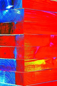 Stack of planed wooden blocks. Changed color scheme. Colorful background. T.. Stock Photos