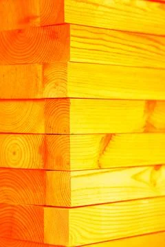 Stack of planed wooden blocks. Changed color scheme. Colorful background. T.. Stock Photos