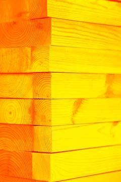 Stack of planed wooden blocks. Changed color scheme. Colorful background. T.. Stock Photos