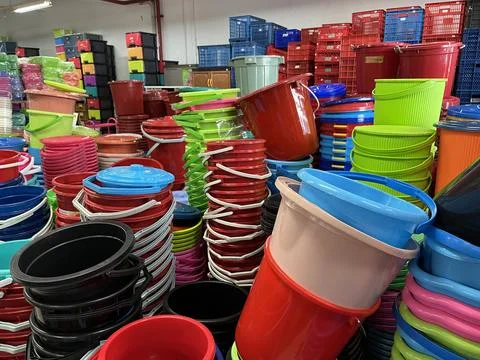 Stack of plastic bucket being displayed in a supermarket Stock Photos