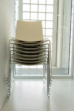 A stack of plastic chairs. Stock Photos