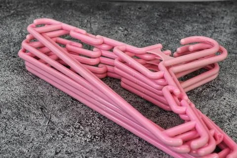 Stack of Plastic Clothes Hangers with Trouser Bar Stock Photos