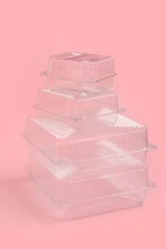 Stack of plastic containers for food on pink background Stock Photos