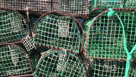 Stack of Plastic Crab and Lobster Cages Highlighting Fishing Industry Pollution Stock Footage 348193008