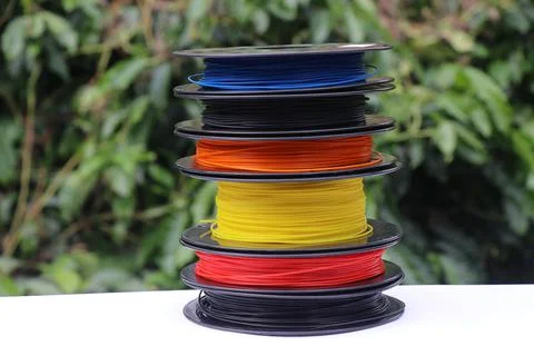 Stack of plastic filaments in a spool used for rapid prototype manufacturing 스톡 사진