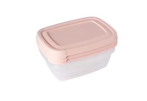Stack of plastic food storage containers with pink lid isolated on white Foto stock