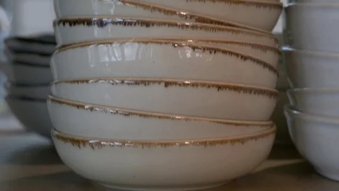 Stack of plates and bowls in a restaurant, close up Stock Footage 119300586