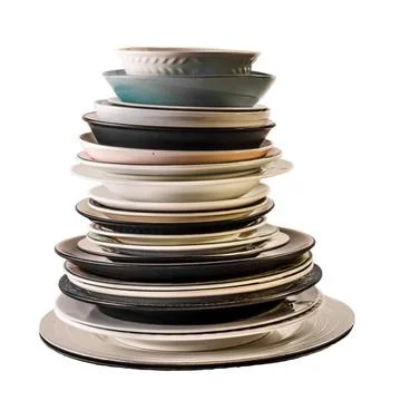 Stack of Plates Assorted plates of different shapes, sizes and colours, al... Stockfoto's