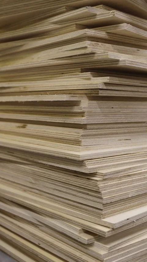 Stack of plywood sheets in woodworking workshop. Natural wood material for furni Stock Footage 327973742