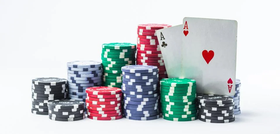 Stack of poker chips and two aces on a white background Stock Photos