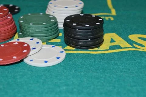 Stack of poker chips on a gambling table Stock Photos