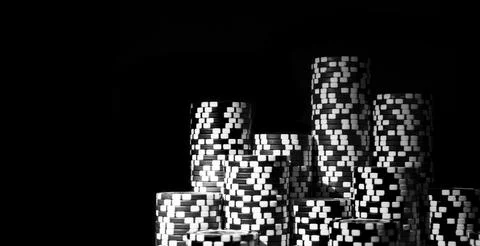Stack of Poker chips isolated on black background. Poker game concept. Play.. Foto stock