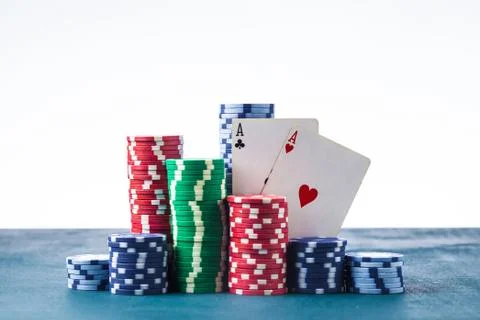 Stack of poker chips with two aces on a white background isolate Stock Photos