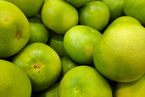 Stack of Pomelos on a market stall Stock Photos