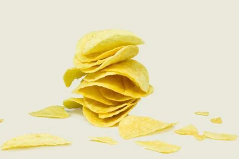 Stack of potato chips on a white Stock Photos