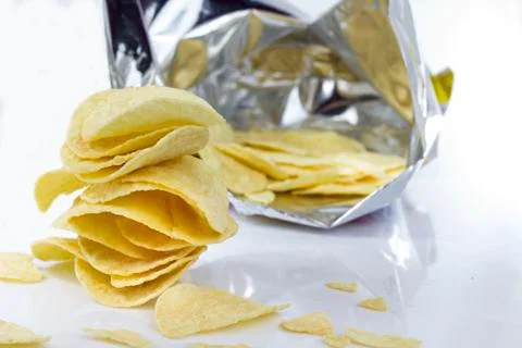 Stack of potato chips on a white Stock Photos