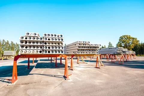 Stack of precast reinforced concrete slabs in a house-building factory worksh Stock Photos